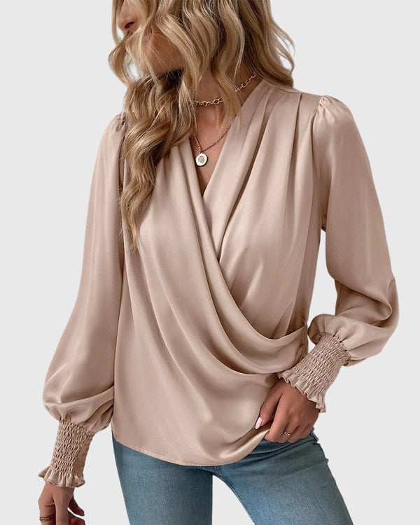 Dia | Elegante blusa con cuello en V y mangas abullonadas
